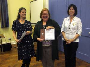 Jacqui Hogan receives her certificate for finishing 3rd in the 2013 MSC Table Topics Contest.
