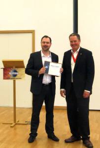 Chris being awarded as Best Table Topics' Speaker.