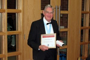 A very proud-looking Norman with his certificate & engraved pen, commemorating 30 years since founding the club.