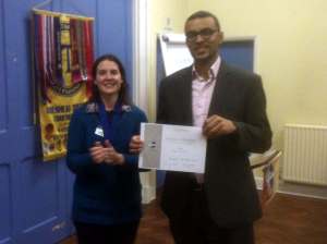 Yohan receiving his certificate for finishing as runner-up in the Club Speech Contest.